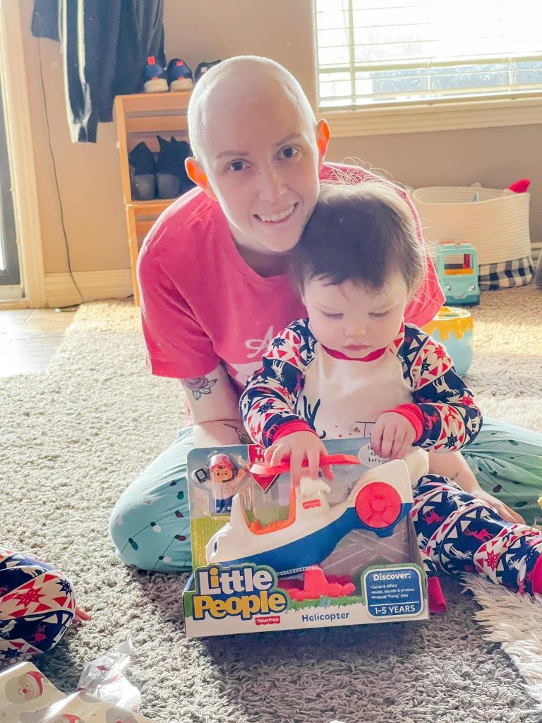 Hailey and her baby at play. Hailey is in treatment for stage IV, grade 4 cancer.